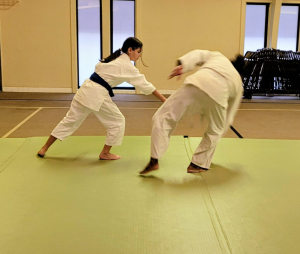 Children practicing basic aikido rolls (ukemi)
